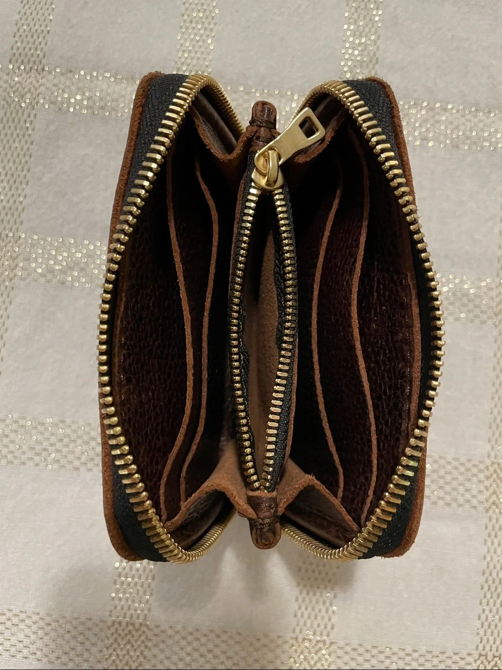 Portland Leather Goods brown wallet, gold tone zipper, inside holds coins/cards